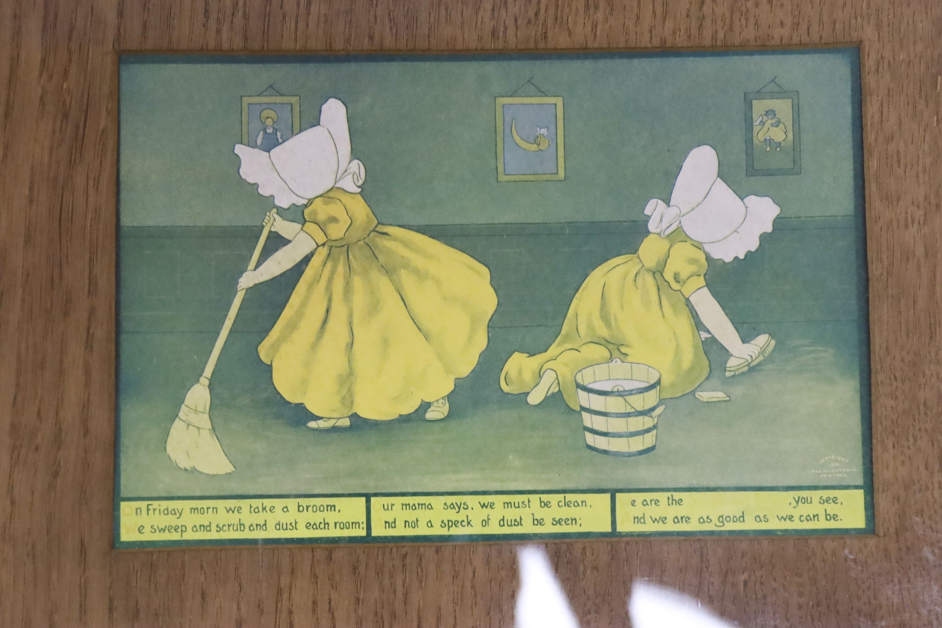 A set of seven sunbonnet twins oak framed 'days of the week' litho prints copyright 1905 by the Ullman mfg Co. New York